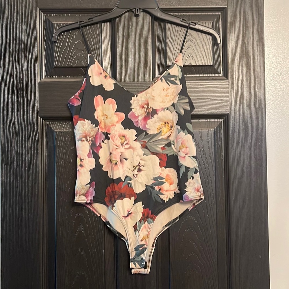 Gaze L bodysuit. Floral design. Snaps for closure.